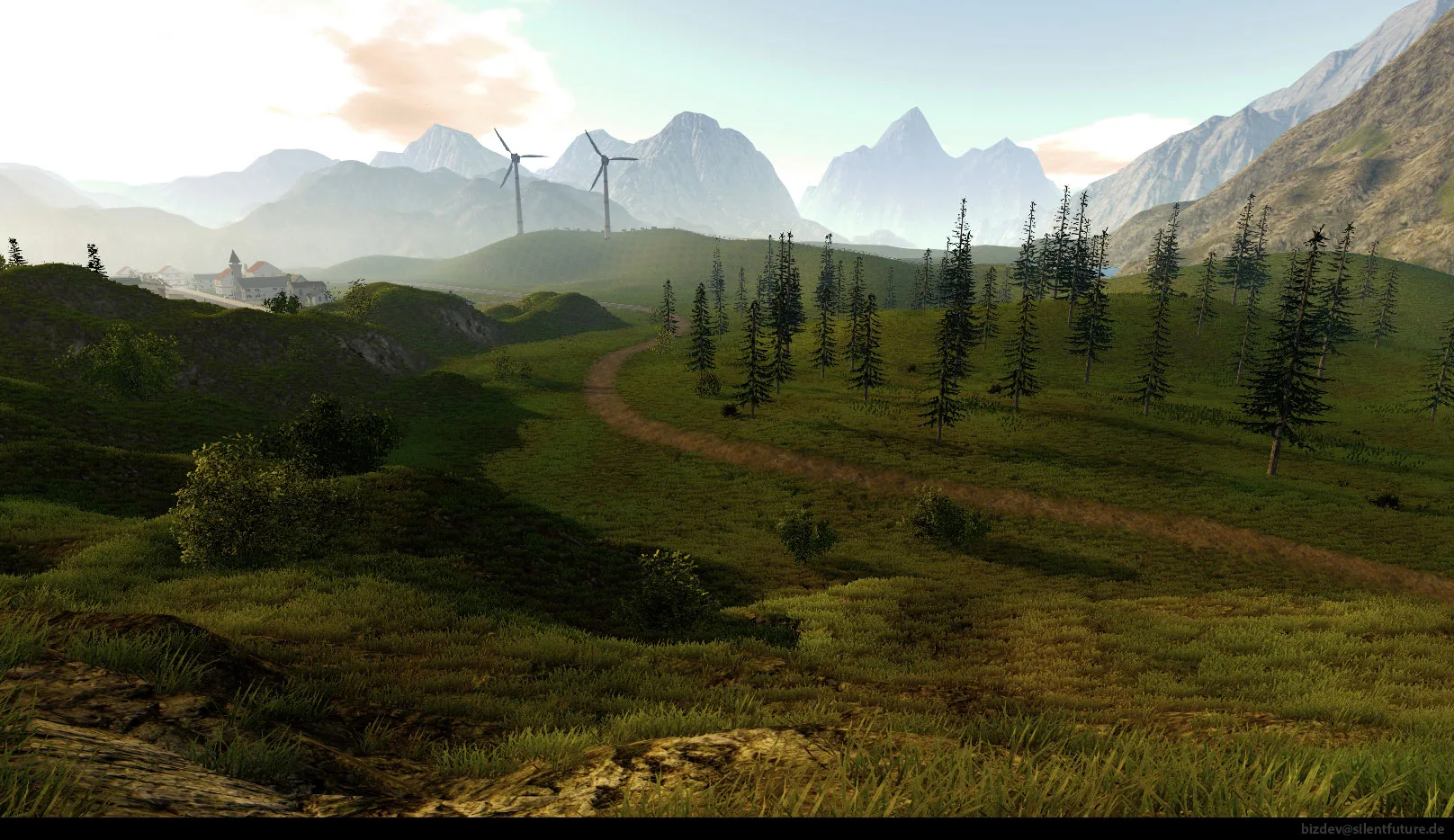 A green mountain landscape with a village and wind turbines